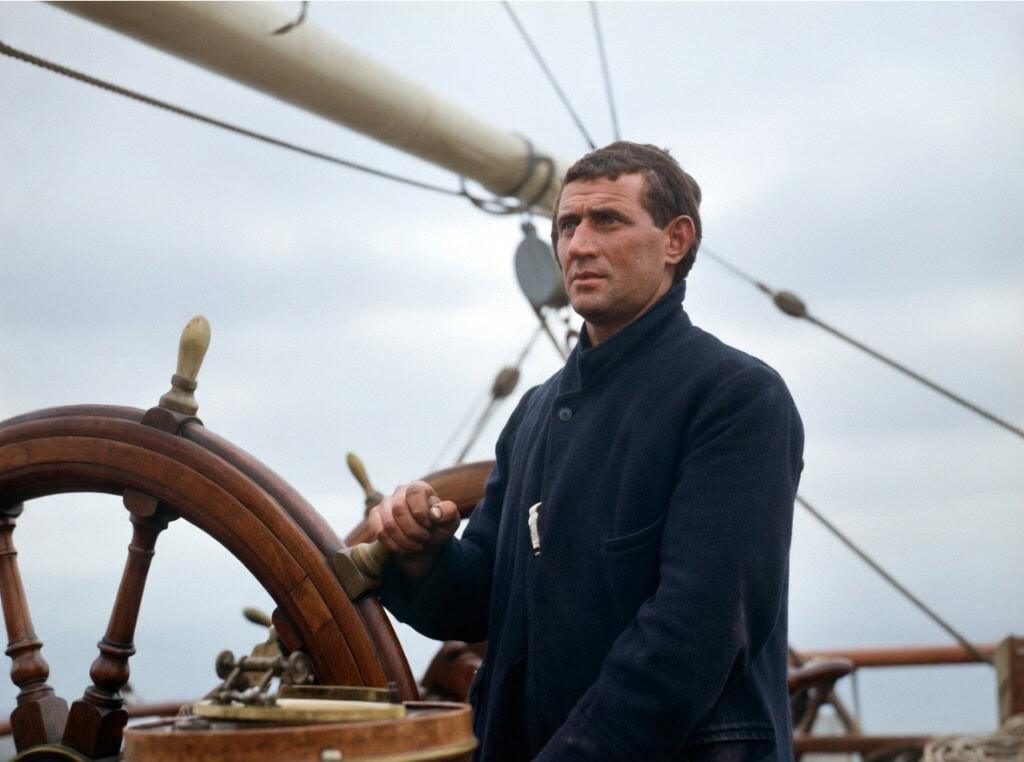 Tom Crean at the wheel of the Terra Nova ship during the 1913 return voyage from Antarctica